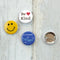 Our three pin "kindness button set" is a bright and happy way to remind everyone around you that kindness matters.
