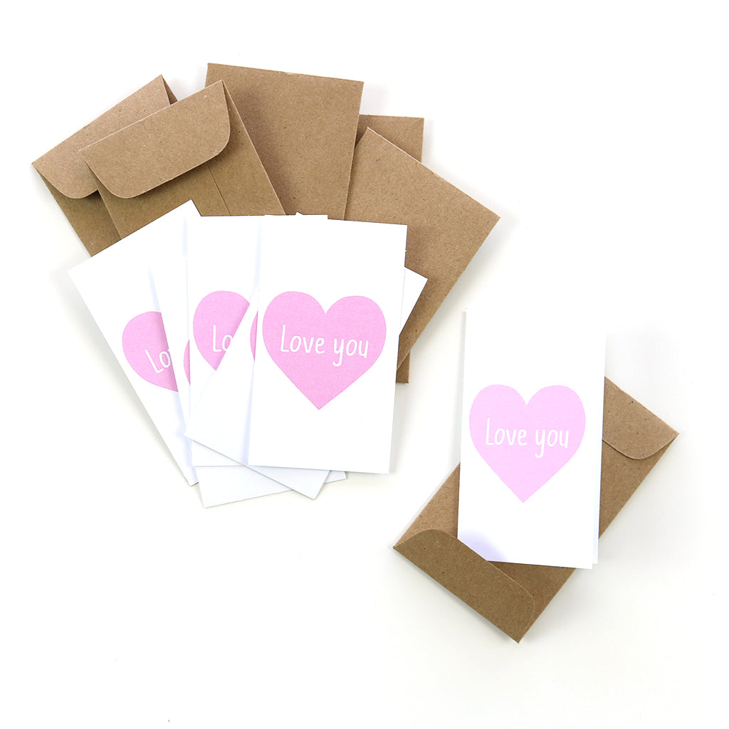 Our mini cards are perfect to have on hand. This pink heart "love you" card makes a great lunchbox note or tucked in luggage for your favorite traveler. Stock up today!